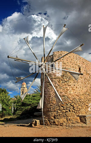 Traditional windmill at Toplou monastery, close to famous Vai beach, Sitia, Lasithi prefecture, Crete, Greece. Stock Photo