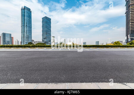 Empty Road with modern business office building  Empty Road with modern business office building Stock Photo
