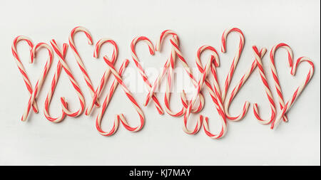 Christmas holiday red candy cane pattern, texture and background on white background, flat-lay Stock Photo
