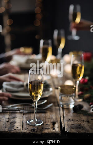 People having party. Christmas time. Holiday celebration table setting Stock Photo