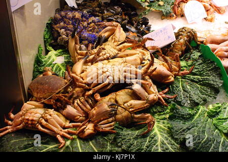 Crabs and shrimp to buy on display at the seaside fish market Stock