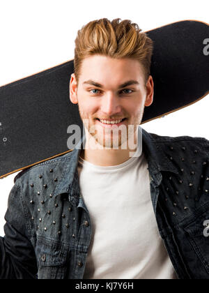 Studio portrait of a young man posing with a skateboard Stock Photo