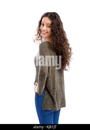 Studio portrait of a beautiful woman with arms crossed and looking back, isolated in white Stock Photo