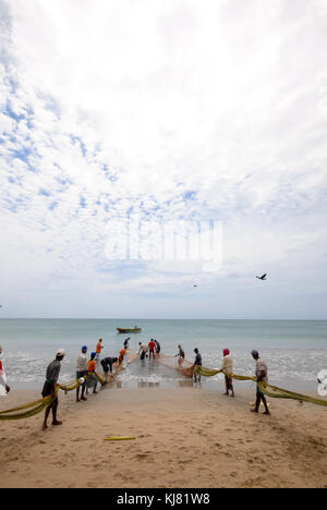fishermen at the beach of Trincomalee, Sri Lanka Stock Photo