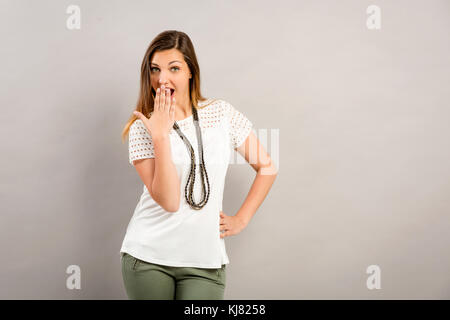 Beautiful young woman amazed with something Stock Photo