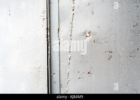 Silver painted sheets of steel metal with welds and fabrications joining the sheet metalwork together Stock Photo