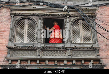 Woman in old Newari home, Swayambhunath, Kathmandu, Nepal Stock Photo