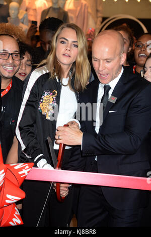 NEW YORK, NY - NOVEMBER 17: H&M North American President Daniel Kulle and Cara Delevingne attend H&M and Cara Delevingne to celebrate the opening of a new location at Westfield World Trade Center at H&M on November 17, 2016 in New York City   People:  Cara Delevingne Stock Photo