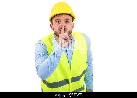 Workman making silence gesture over isolated white background Stock Photo