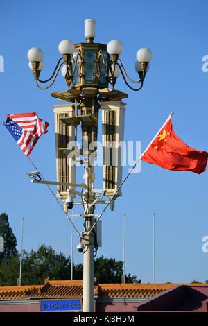 Shanghai, China - November 9, 2017:  US and Chinese flags are on display outside the Forbidden City are for the State Visit Plus of President Donald T Stock Photo