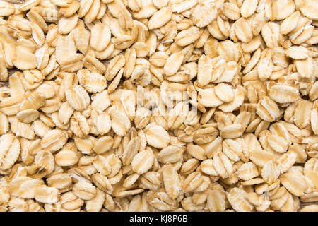 Avena Sativa is scientific name of Oat cereal grain. Also known as Aveia or Avena. Closeup of grains, background use. Stock Photo