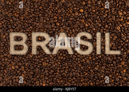 Brasil coffee concept text on roasted beans and jute fabric as high quality country origin Stock Photo