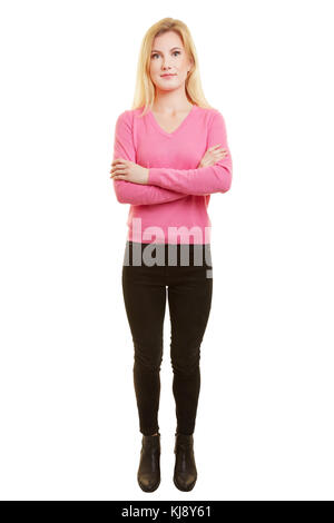 Young woman from the front with crossed arms as full body shot Stock Photo