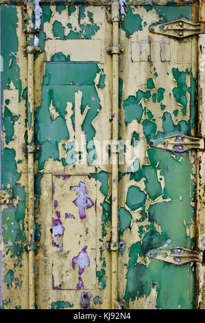 Flaking paint on the door of an old shipping container Stock Photo