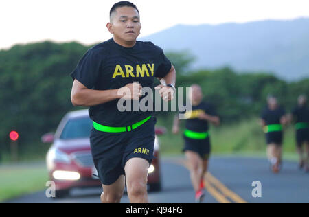 SCHOFIELD BARRACKS, Hawaii – Sgt. 1st Class Ricky Ichihara, a Career Counselor with 3rd Battalion, 7th Field Artillery Regiment, 25th Infantry Division, races towards the finish line November 15, during a physical fitness test for the 25th Inf. Div. Career Counselor of the Year competition. The Career Counselor of the Year Competition is designed to test unit Career Counselor’s skills, physical fitness and knowledge in their career field. (U.S. Army photo by Sgt. Ian Ives, 25th Sustainment Brigade Public Affairs /Released) Stock Photo