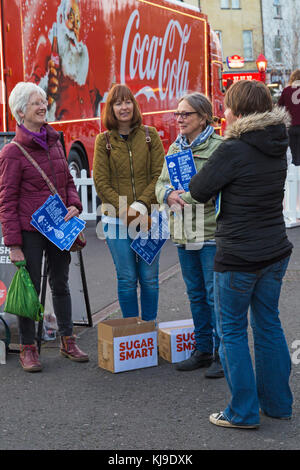 Bournemouth, Dorset, UK. 23rd Nov, 2017.  Sugar campaigners protest at the arrival of the Christmas Coca Cola truck in Bournemouth. The Sugar Smart campaign run by Jamie Oliver and the charity Sustain help to reduce the amount of sugar we consume. Members of Poole and Bournemouth Sugar Smart campaign believe sugary drinks contribute to child obesity. Volunteers, calling themselves tooth fairies, stand by the truck handing out free water and toothbrushes. Credit: Carolyn Jenkins/Alamy Live News Stock Photo