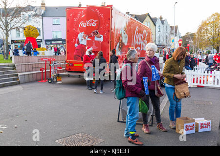 Bournemouth, Dorset, UK. 23rd Nov, 2017. Sugar campaigners protest at the arrival of the Christmas Coca Cola truck in Bournemouth. The Sugar Smart campaign run by Jamie Oliver and the charity Sustain help to reduce the amount of sugar we consume. Members of Poole and Bournemouth Sugar Smart campaign believe sugary drinks contribute to child obesity. Volunteers, calling themselves tooth fairies, stand by the truck handing out free water and toothbrushes. Credit: Carolyn Jenkins/Alamy Live News Stock Photo