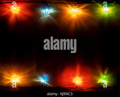 christmas garland lights on blue wooden background with copy space for your text. Top view. View with copy space Stock Photo