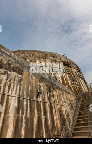 Remnants of the occupying German forces' Atlantic Wall defenses against the invasion of France. disused bunkers litter the landscape. Stock Photo