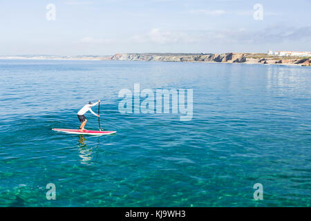 A senior man practicing paddle on a beautiful sunny day Stock Photo