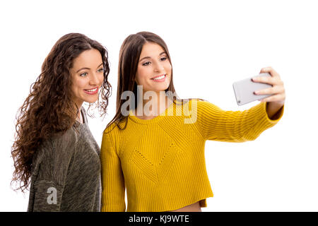 Teen girls with smartphone taking selfie Stock Photo