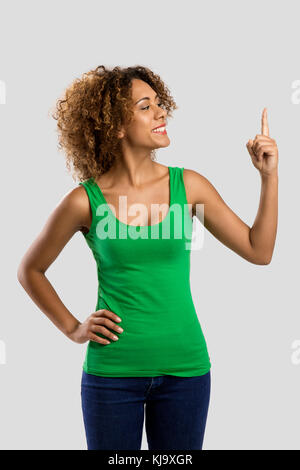 Beautiful African American woman showing and looking to her finger Stock Photo