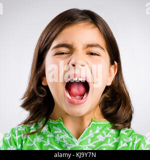 Portrait of a little girl shouting loud Stock Photo