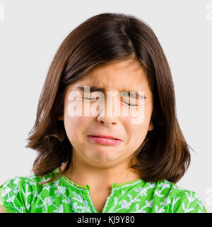 Portrait of a little girl making a sad expression and crying Stock Photo