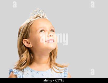Portrait of a cute happy little girl wearing a princess crown Stock Photo