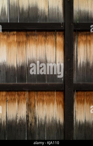Weathered old wooden structure in an iron frame full frame Stock Photo