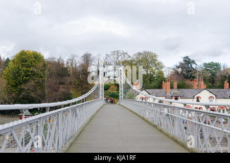 The Queen's Park Suspension Bridge crossing the River Dee in the historic city of Chester, UK and linking The Groves with the suburb of Queen's Park Stock Photo