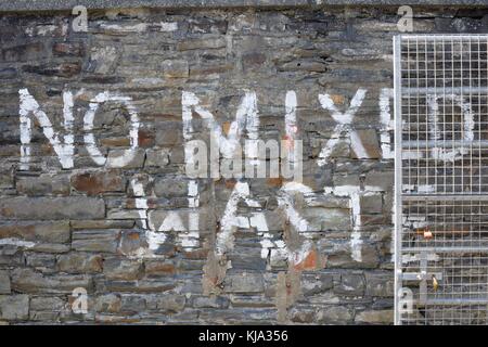 No Mixed Waste  sign painted on a stone wall, Wales, UK Stock Photo