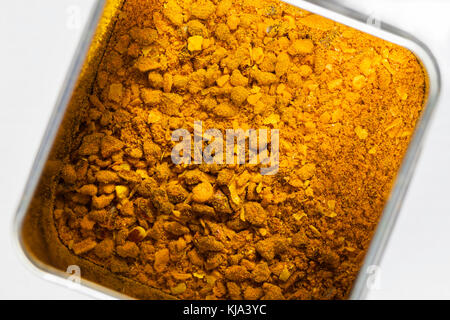Curry Madras spice mixture in a metal can seen from above Stock Photo