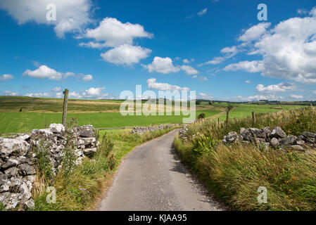 Quiet country lane near Hartington in the White Peak, Derbyshire, England. Stock Photo