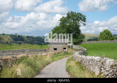 Quiet country lane near Hartington in the White Peak, Derbyshire, England. Stock Photo