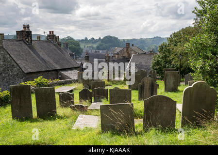 Gravestones in the churchyard of St Gile's church, Hartington, Derbyshire, England. Stock Photo