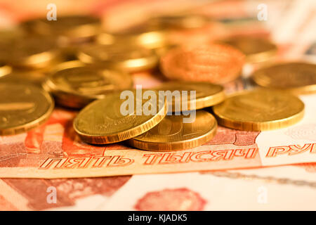 Set of russian ruble coins laying on russian banknotes. Russian currency close up. Financial concept. Stock Photo