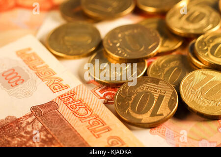 Set of russian ruble coins laying on russian banknotes. Russian currency close up. Financial concept. Stock Photo