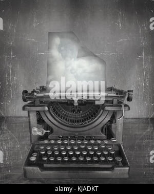 Surreal imagine in black and white of a beautiful classic old fashioned typewriter with a paper with clouds in a vintage style Stock Photo