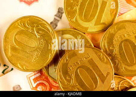 Set of russian ruble coins laying on russian banknotes. Russian currency close up. Financial concept. Stock Photo