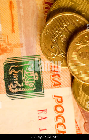 Set of russian ruble coins laying on russian banknotes. Russian currency close up. Financial concept. Stock Photo