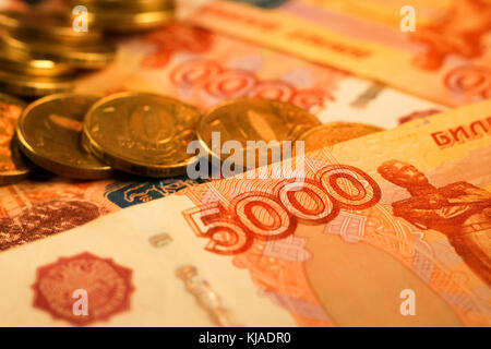 Set of russian ruble coins laying on russian banknotes. Russian currency close up. Financial concept. Stock Photo