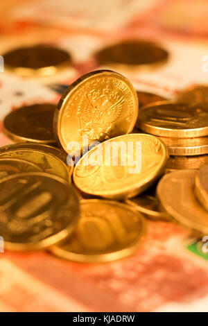 Set of russian ruble coins laying on russian banknotes. Russian currency close up. Financial concept. Stock Photo