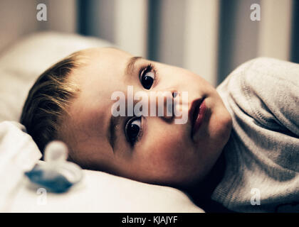 Weaning toddler off dummy / pacifier at bed time, child with dummy / child with pacifier Stock Photo