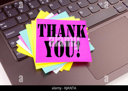 Writing Thank You text made in the office close-up on laptop computer keyboard. Business concept for Giving Gratitude Appreciate Message Workshop on t Stock Photo