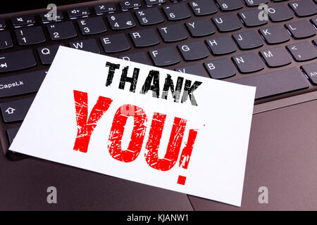 Writing Thank You text made in the office close-up on laptop computer keyboard. Business concept for Giving Gratitude Appreciate Message Workshop on t Stock Photo