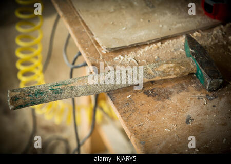 old hammer lying on the old table Stock Photo