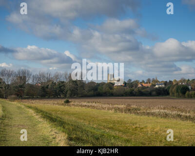 View looking back to Orford in Suffolk UK from the footpath along the bank of the river Orde showing the castle and the church Stock Photo