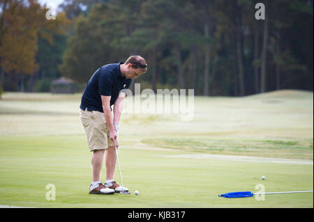 171103-N-BD319-033 VIRGINIA BEACH, Va. (November 02, 2017) Lt. David Childers, the assistant training officer assigned to the Nimitz-class aircraft carrier USS George Washington (CVN 73), golfs on Eagle Haven Golf Course at Joint Expeditionary Base Little Creek during the Navy Supply Corps Foundation Hampton Roads Fall Golf Tournament. Naval Special Warfare Group 2 Logistics and Support Unit and Expeditionary Support Unit 2 hosted the event. George Washington is undergoing a refueling and complex overhaul (RCOH) at Newport News Shipyard. RCOH is a nearly four-year project performed only once d Stock Photo