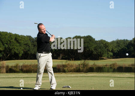 171103-N-BD319-104 VIRGINIA BEACH, Va. (November 02, 2017) Cmdr. Kelly House, the supply officer assigned to the Nimitz-class aircraft carrier USS George Washington (CVN 73), golfs on Eagle Haven Golf Course at Joint Expeditionary Base Little Creek during the Navy Supply Corps Foundation Hampton Roads Fall Golf Tournament. Naval Special Warfare Group 2 Logistics and Support Unit and Expeditionary Support Unit 2 hosted the event. George Washington is undergoing a refueling and complex overhaul (RCOH) at Newport News Shipyard. RCOH is a nearly four-year project performed only once during a carri Stock Photo